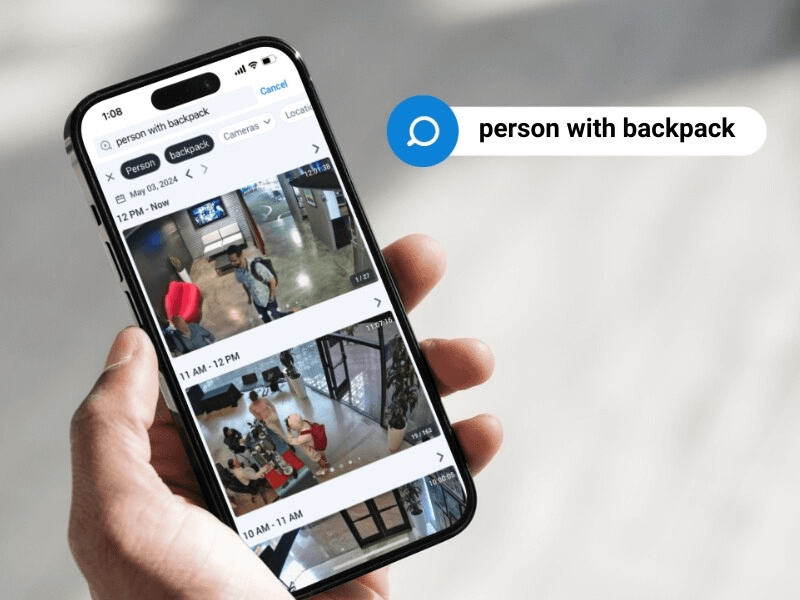 person with backpack featured in security footage on phone